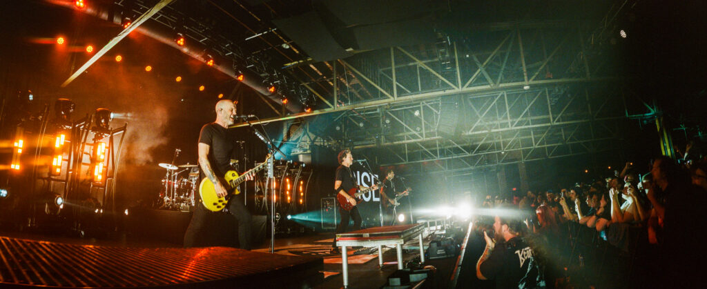 Concert photographer uses a widelux camera to photograph Rise Against